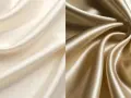 Zwei Stoffbahnen in Creme und Gold, die die glatte, glänzende Textur von Satin zeigen.